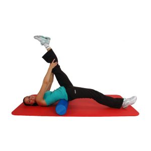 The picture shows Mambo Max Pilates Foam Roller which is the demonstration practice on how to use the product.