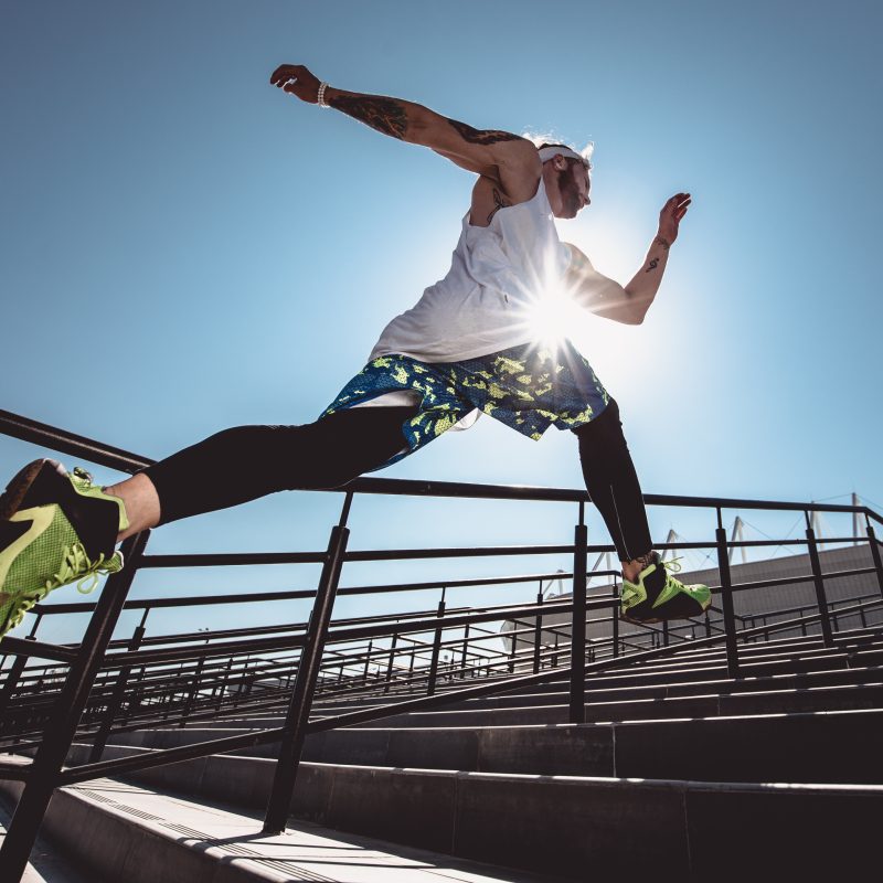 Young man doing high-impact cardio exercise.