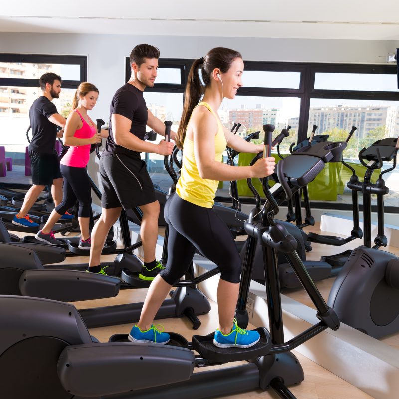 Low-impact cardio exercise on a trainer elliptical at the gym.