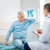 Elderly man consulting with his doctor.