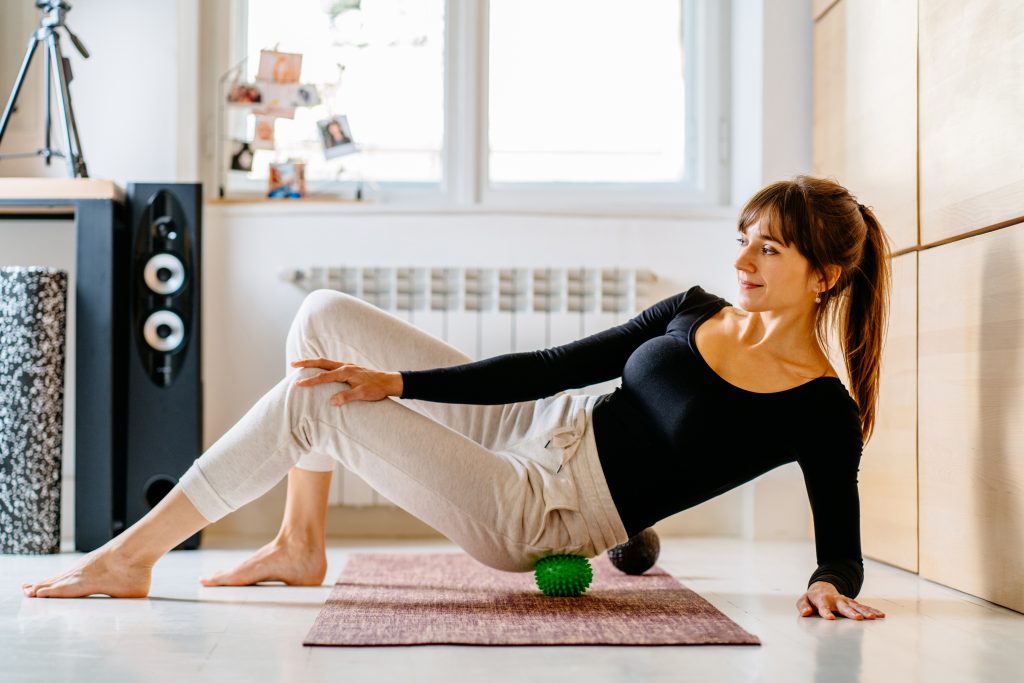 Woman doing DIY massage for her MPS.