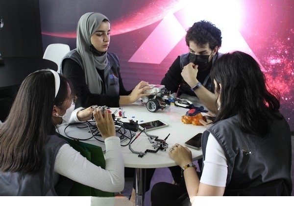 Picture of students at a table preparing to go out