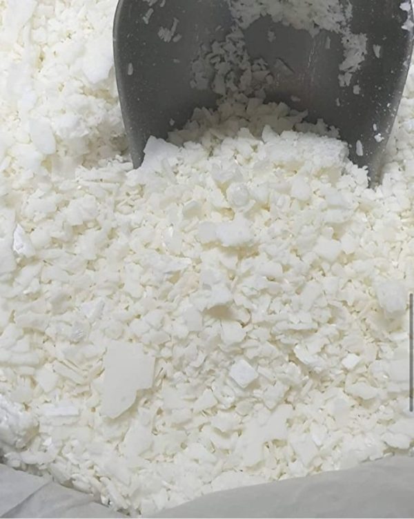 Image of small white pellets of paraffin wax, Paraffin wax is a commonly used product in physiotherapy for its therapeutic benefits.