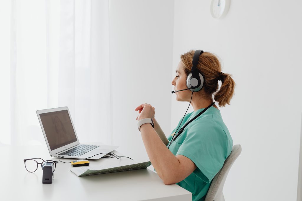 A physiotherapist talking to a client online