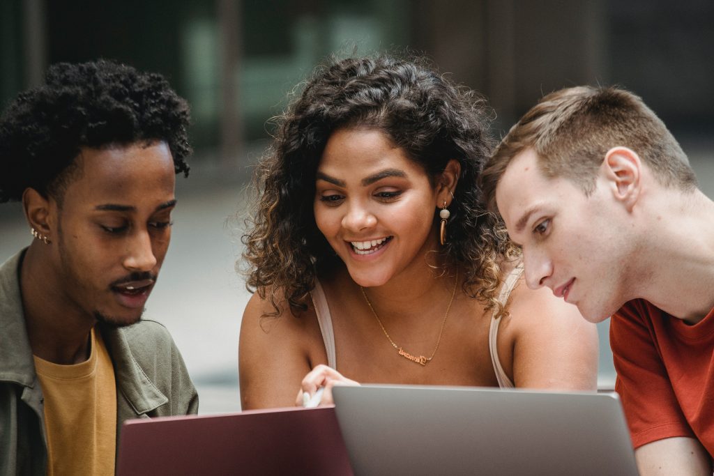 Two guys and a girl checking their Physiotherapy exam results